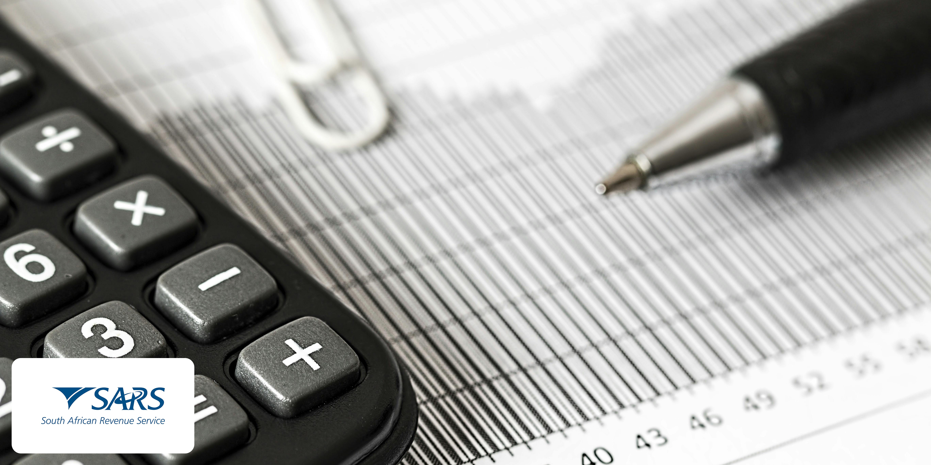 A banner image showing a cropped calculator and a pen on top of some documents